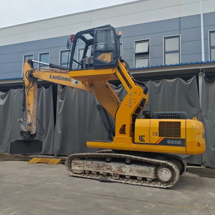 When should an excavator with a cab-lifting mechanism be used?